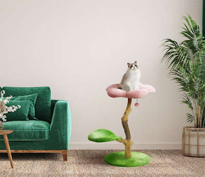 Modern floral cat tree with green base and lower level, pink upper level, and a cat